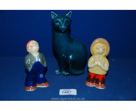 A pair of Wade salt and pepper Pots for 'RHM Food Ltd. and applied Creativity' together with a Poole Cat, 6 1/4'' tall.