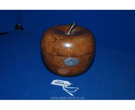 A Fruitwood Tea Caddy in the form of an apple with foil lining, 5'' tall x 5'' diameter.