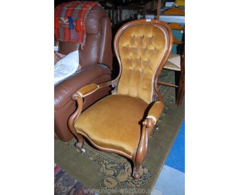 A Victorian Mahogany show frame hoop back Salon Elbow Chair with button upholstered back, swept pad arms on scroll supports, 