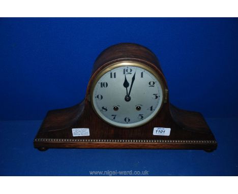 A 1920's Napoleon Hat Oak Cased Mantle  Clock with Chiming Movement.