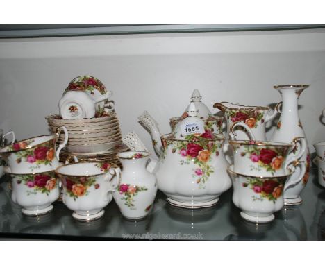 A quantity of Royal Albert 'Old Country Roses' china including cake plate, bread and butter plates, two teapots, jugs, cup, s