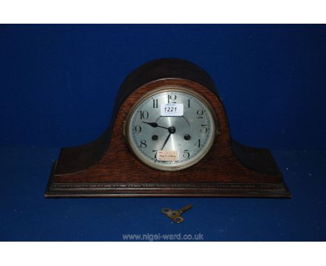 A Smiths Walnut cased Deco style eight day Mantle Clock, with shaped sides, domed case and sleigh style feet, white alloy fac