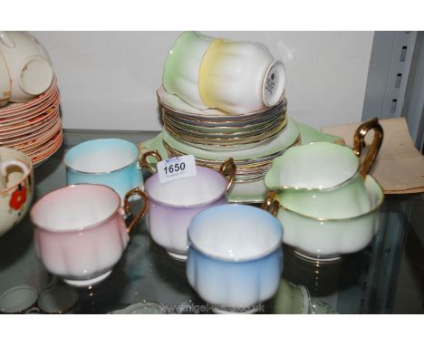 A Royal Albert vintage part Teaset, in harlequin pastel colours comprising six cups, saucers and tea plates, cake plate, milk