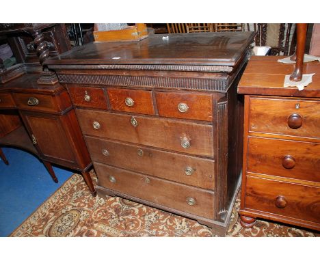 A circa 1820 Oak Chest of three short over three long graduated Drawers, the moulded edge rectangular top over applied Aztec 