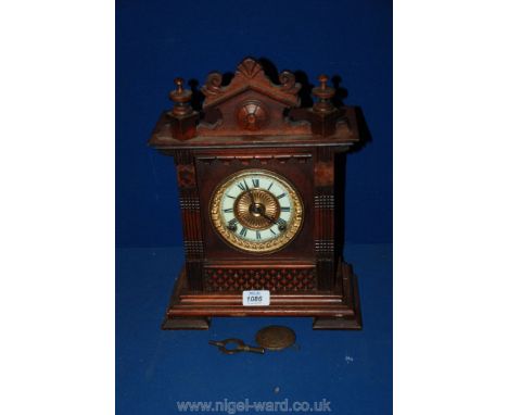 A Victorian Oak mantle Clock.