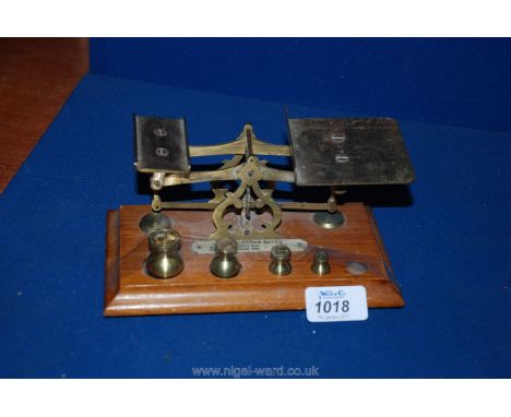 A set of Inland Letter Scales with four weights.