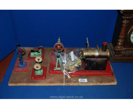 A Mamod Steam Engine mounted on a board, with various machines including grindstone, buffing wheel, mechanised punch
