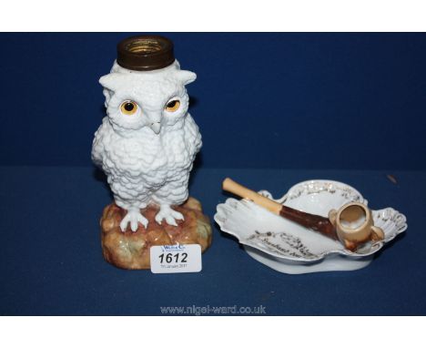 A novelty oil lamp base in the form of an owl with glass eyes - c. 1890 and a scarce and unusually fine German export 'pipe a