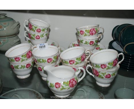 A twelve setting Royal Vale part Teaset with pink rose decoration comprising cups, saucers, tea plates, bread & butter plate,