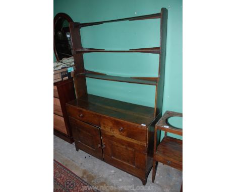 An early 19th c. Country-made Oak Dresser of small proportions, rudimentary plate rack with three graduated shelves, the two 