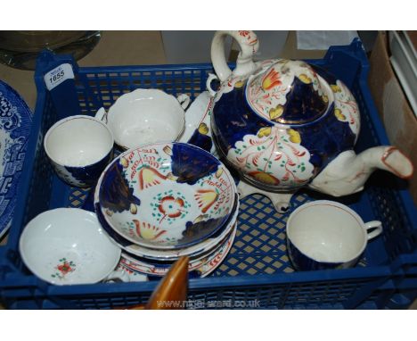 A quantity of Gaudy Welsh china including teapot, tea cups and saucers