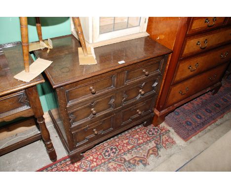 A reproduction Oak Jacobean style Flight of three Drawers with bull nose moulded rectangular top over the three long drawers 