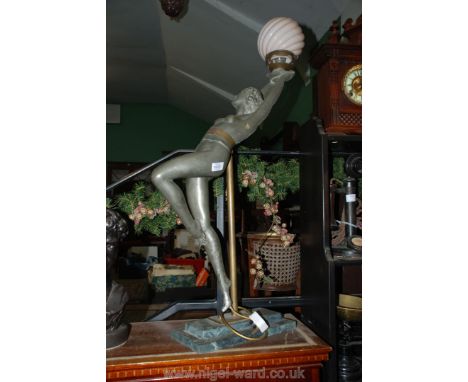 A 1930's metal figure of a Girl holding a ball, mounted on marble and made into a lamp, the figure being 30'' tall approx.