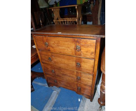 A 1930's Oak Flight of four Drawers, having rectangular top with beaded edge, the four Oak lined drawers having brass plate b