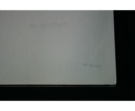 THE BEATLES - A top opening copy of The White Album, numbered 0334627. Album is complete with poster, portrait & black inner 