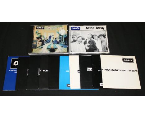 OASIS - collection of 12 Oasis promo CDs to include Definitely Maybe 5 track promo (SAMP 2218), Slide Away (CCD169), Be Here 