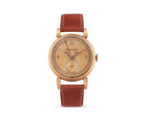 Jaeger-LeCoultre calendar, 50s18k rose gold stepped round case, n.419019, flame lugs.Two-tone cream coloured dial, applied in
