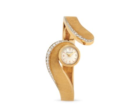 Jaeger-LeCoultre bracelet watch, 70s18k gold round case, n.599648.Argenté dial, applied arabic numerals and indexes.Hand-wind