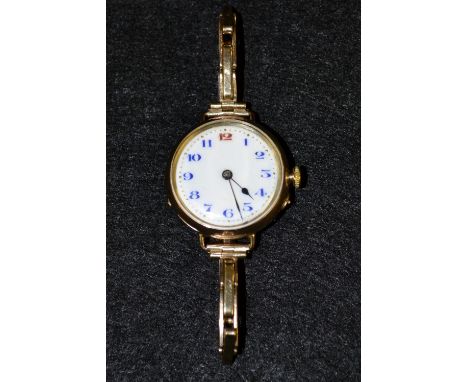 A lady's 9ct rose gold watch, white enamel dial, blue and red Arabic numerals, minute track, manual wind movement, circular 9