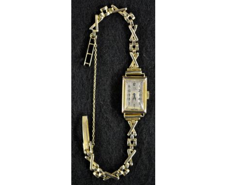 Record - a lady's 9ct gold wristwatch, rectangular silvered dial, Arabic numerals, minute track, blued hand, Record 109 15 je