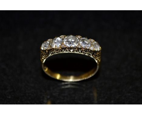 A diamond thirteen stone ring, central cushion cut diamond, flanked to either side by two smaller round cut diamond, each div