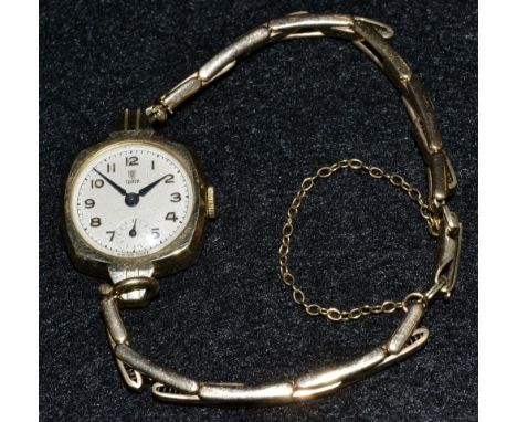 Tudor Rolex - a vintage lady's 9ct gold bracelet watch, cushion case, round textured dial, Arabic numerals, minute track, sub