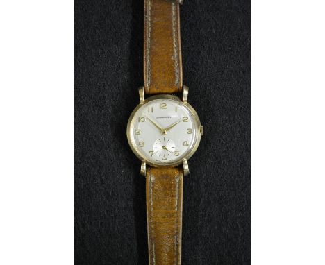 A vintage Garrards 9ct gold cased gentleman's wristwatch, silvered dial, gold Arabic numerals, minute track, subsidiary secon