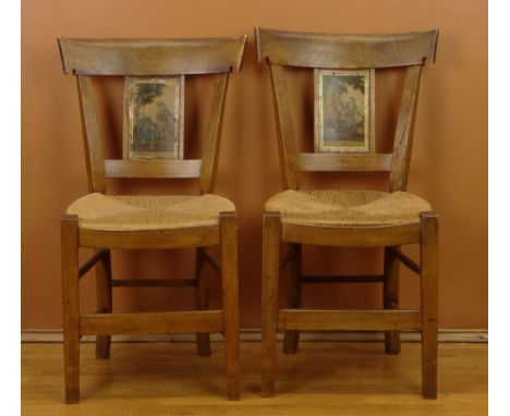Four (4) 19th Century French Provincial Fruitwood Side Chairs with Rush Seats each with a Color Engraving to the Back Splat. 