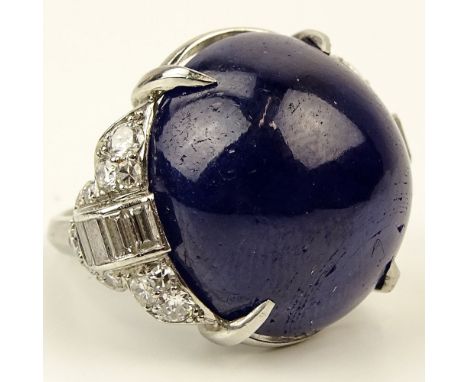 Lady's Art Deco Large Cabochon Sapphire, Diamond and Platinum Ring. Sapphire measures 20mm diameter. Unsigned. Good condition