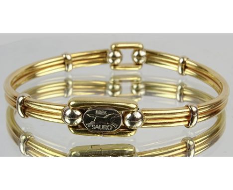Vintage 18 Karat Yellow Gold Sauro Bangle Bracelet. Signed. Good condition. Measures 3/8 inch wide, 2-1/2 inches interior dia