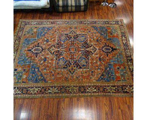 Antique Heriz Rug circa 1900. 16 knots per square inch. Colors of salmon, teal, royal, navy, camel, ivory, brick. Condition f