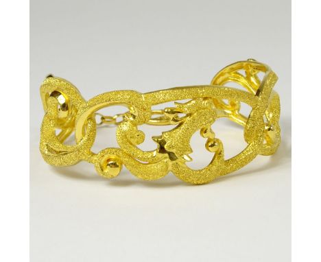 Asian 24 Karat Yellow Gold Bangle Bracelet. Signed and stamped 999.9. Very good condition. Measures 1 inch wide, 2-3/8 inches