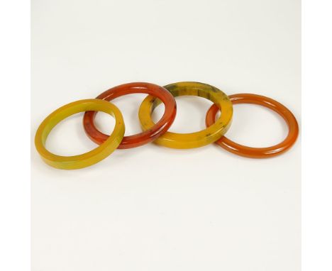 Collection of Four Vintage Bakelite Bangle Bracelets. Unsigned. Good vintage condition. Largest measures 3/8 inch wide, 2-1/2