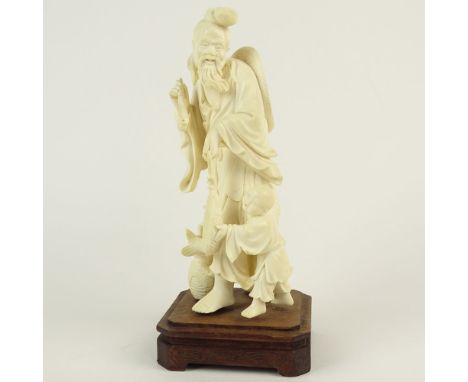 Early 20th Century Chinese Carved Ivory Figurine "Fisherman and Boy" Unsigned. Affixed to inlaid base. Small loss to pipe ste