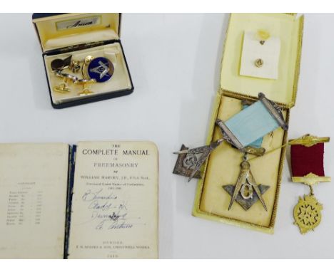 A collection of silver and gilt metal Masonic regalia to include badges, pendants, cufflinks, etc together with a Complete Ma
