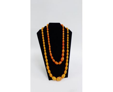 Two vintage strands of amber coloured graduated beads (2) 