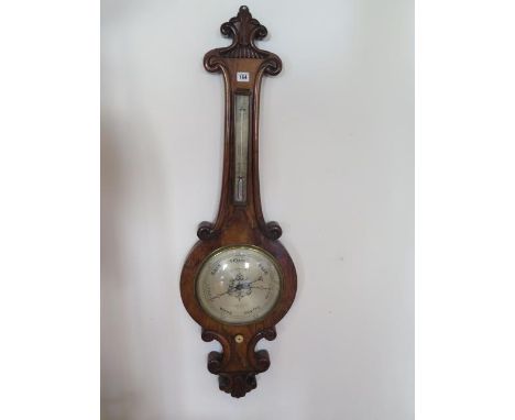 A 19th century walnut with thermometer, signed C Rimondi Halifax, 115cm tall, in good condition, no bubbles in tube 