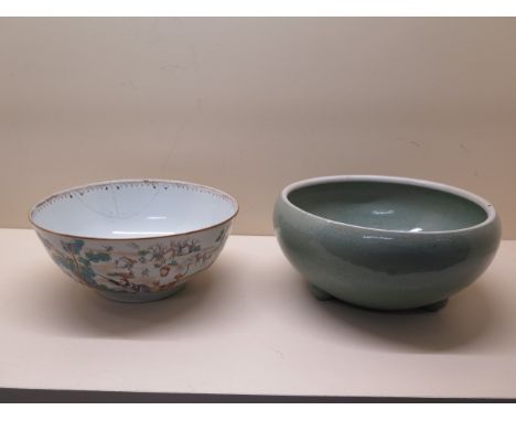 A Chinese Qianlong period bowl enamel decorated with a hunting scene together with a later celadon bowl, largest 25cm x 12cm,