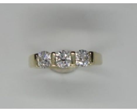 A 14ct yellow gold three stone diamond ring, size M, each diamond approximately 0.33ct, in good condition, diamonds bright an