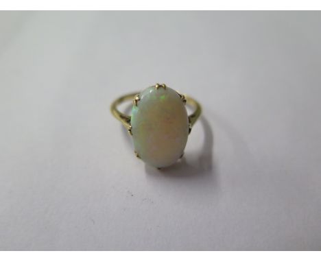 An 18ct opal ring, size M/N, opal approx 15mm x 10mm x 3.5mm, approx 3.2 grams 