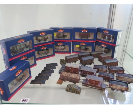 A collection of Hornby and Bachmann rolling stock, 11 with boxes, all have been lightly weathered and none standard couplings