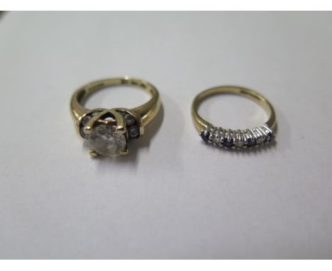 A 14ct CZ ring, size M, approx weight 4.7 grams and a 9ct seven stone ring, size K, approx weight 1.4 grams 