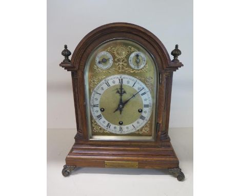 A good quality oak presentation chiming mantle clock, chiming on five gongs, movement stamped W &amp; H Sch, no pendulum or k
