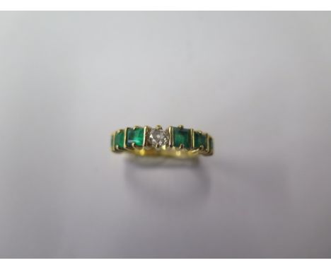 A hallmarked 18ct yellow gold seven stone emerald and diamond ring, size L, in good condition, approx 3.2 grams (ref 7239) 