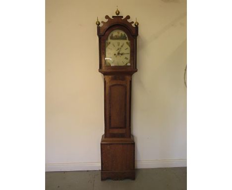 An oak and mahogany 8 day striking longcase clock with a 12" painted arched dial having secondary dial  and calendar, signed 