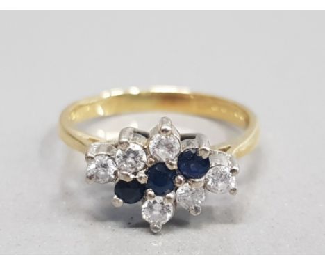 18CT YELLOW GOLD SAPPHIRE AND DIAMOND CLUSTER RING FEATURING 3 SAPPHIRES SET IN THE CENTRE WITH 3 DIAMONDS SET EACH SIDE SIZE