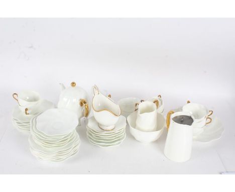 Quantity of Coalport tea and coffee ware,&nbsp; with gilded handles on a white ground and frilled edges, with tea pot, cups, 