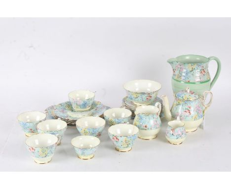 Shelley "Melody" part teaset, comprising teapot, two cream jugs,one large jug, two sugar bowls, seven tea cups, seven saucers