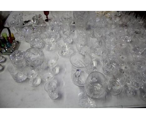 Large quantity of mostly cut glass ware, to include tumblers, vases, champagne saucers, sherry glasses, pedestal bowl with fr