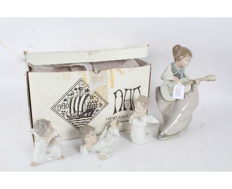 Three Lladro porcelain cherubs, and a Nao figurine of a lady playing a guitar (4)